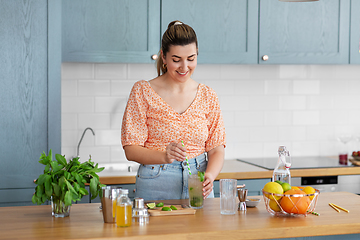 Image showing woman making cocktail drinks at home kitchen