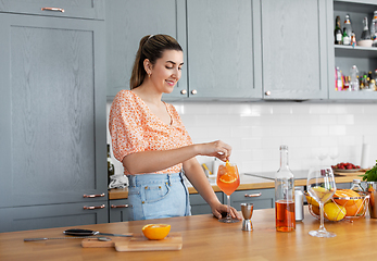 Image showing woman making cocktail drinks at home kitchen