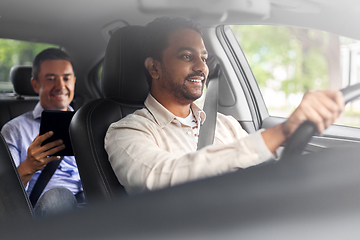 Image showing indian male driver driving car with passenger