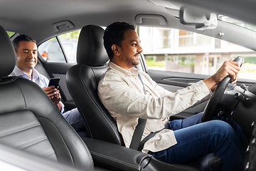 Image showing male passenger with smartphone in taxi car