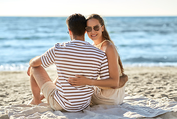 Image showing happy couple hugging on summer beach