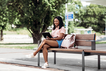 Image showing african american woman with tablet pc in city