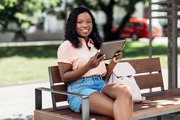 Image showing african american woman with tablet pc in city