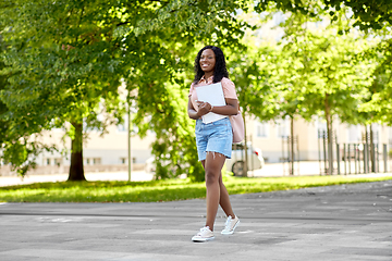 Image showing african student girl with notebooks in city