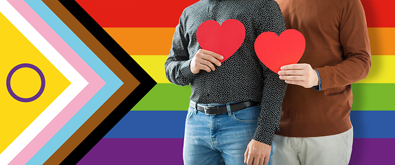 Image showing close up of male gay couple with red hearts