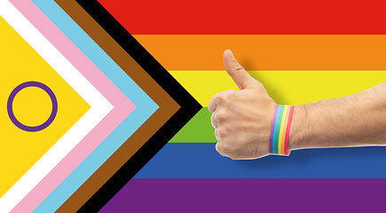 Image showing hand with gay pride rainbow wristband shows thumb