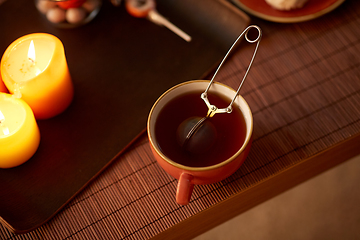 Image showing mesh tea infuser ball in ceramic mug on halloween