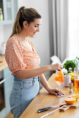 Image showing woman making cocktail drinks at home kitchen