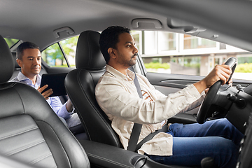 Image showing indian male driver driving car with passenger