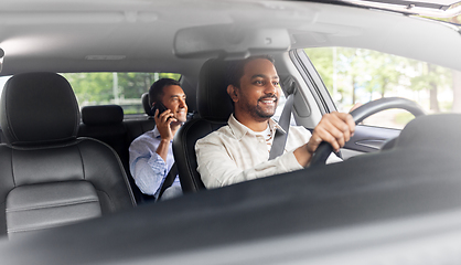 Image showing male passenger calling on smartphone in taxi car