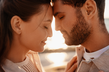 Image showing happy couple with closed eyes on summer beach