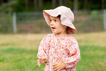 Image showing happy little baby girl outdoors in summer