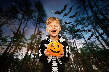 Image showing happy boy in halloween costume with jack-o-lantern