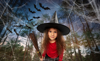 Image showing girl in black witch hat with broom on halloween