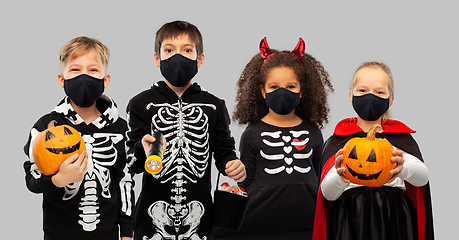 Image showing children in halloween costumes and reusable masks