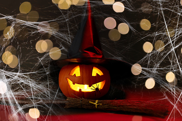 Image showing halloween jack-o-lantern in witch's hat and broom