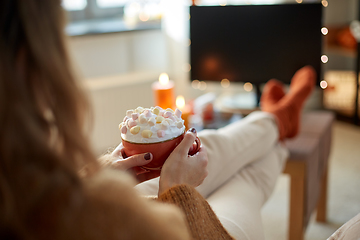 Image showing woman with cream and marshmallow on halloween