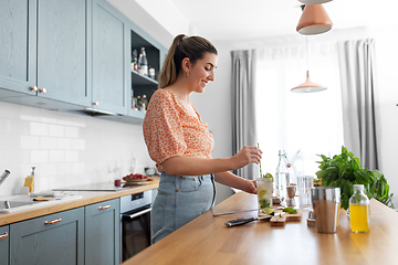 Image showing woman making cocktail drinks at home kitchen