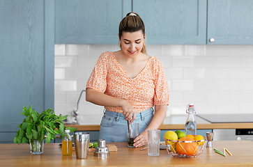 Image showing woman making cocktail drinks at home kitchen