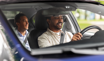 Image showing indian male driver driving car with passenger