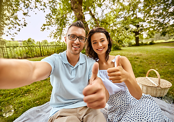 Image showing couple taking selfie and showing thumbs up at park