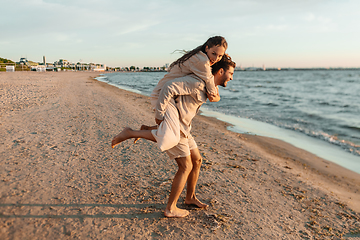 Image showing happy couple having fun on summer beach