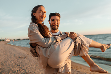 Image showing happy couple having fun on summer beach