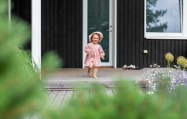 Image showing happy little baby girl having fun outdoors