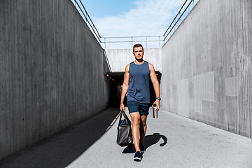 Image showing sportsman with bag and bottle outdoors