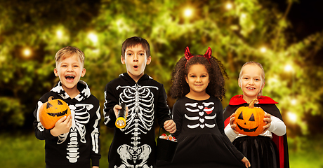 Image showing children in halloween costumes trick-or-treating