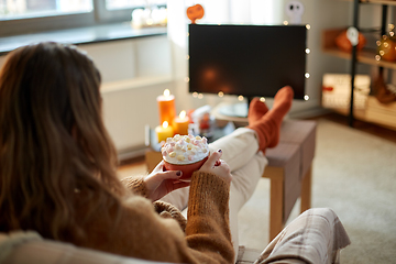 Image showing woman with cream and marshmallow on halloween