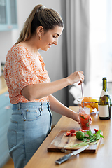 Image showing woman making cocktail drinks at home kitchen