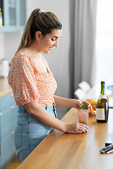 Image showing woman making cocktail drinks at home kitchen