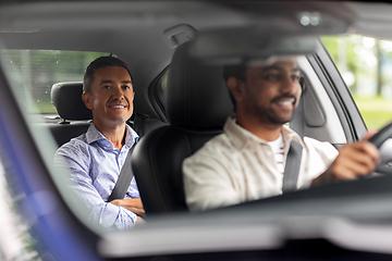 Image showing indian male driver driving car with passenger