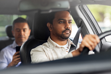 Image showing indian male driver driving car with passenger