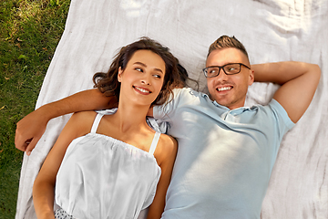 Image showing happy couple on picnic blanket