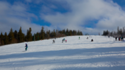 Image showing Blur panoramic view of sport resort for winter vacation. Skies with back light. Warm filter with original sun color tones