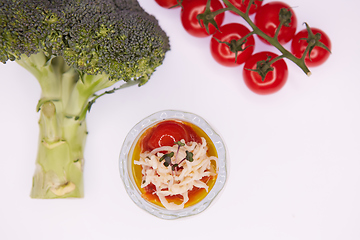 Image showing Vegetarian broccoli green soup puree with tomato