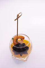 Image showing Appetizer in a glass. Shrimp with vegetable puree with cuttlefish ink. Healthy food. Top view