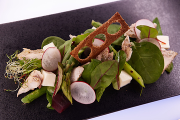 Image showing Green salad with radish and croutons. Shallow dof