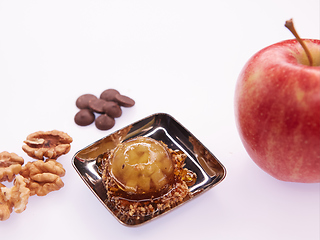 Image showing Fruit jelly with fresh apple. Healthy food. Apple jelly on chocolate with walnuts. Summer dessert with fruit jelly.