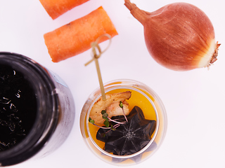 Image showing Appetizer in a glass. Shrimp with vegetable puree with cuttlefish ink. Healthy food. Top view