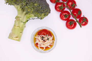 Image showing Vegetarian broccoli green soup puree with tomato