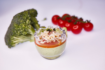Image showing Vegetarian broccoli green soup puree with tomato