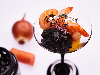 Image showing Appetizer in a glass. Shrimp with vegetable puree with cuttlefish ink. Healthy food. Top view