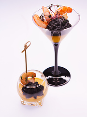 Image showing Appetizer in a glass. Shrimp with vegetable puree with cuttlefish ink. Healthy food. Top view