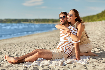 Image showing happy couple hugging on summer beach