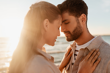 Image showing happy couple with closed eyes on summer beach