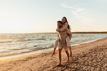 Image showing happy couple having fun on summer beach