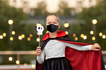 Image showing girl in mask and costume of dracula on halloween